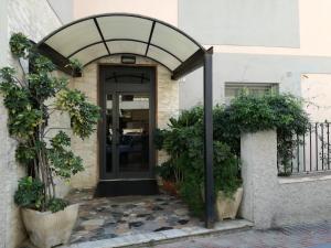 an entrance to a building with an arched doorway at Su Murdegu in Cagliari