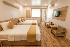 Łóżko lub łóżka w pokoju w obiekcie Summer Dream Hotel