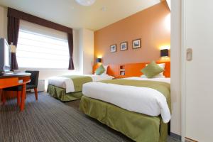 Postel nebo postele na pokoji v ubytování HOTEL MYSTAYS Kyoto Shijo