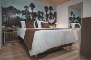 Voodi või voodid majutusasutuse HOTEl PACHAMAMA SPA toas