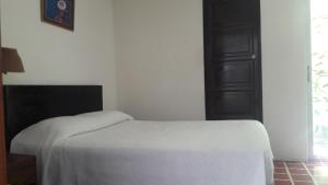 Postel nebo postele na pokoji v ubytování Hotel De Cortez y Larraz