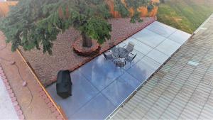 an overhead view of a patio with a table and chairs at The Lindon House in Lindon