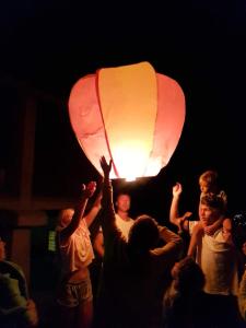 a group of people holding up a lantern at Casa da Ventozella in Penafiel +142 photos