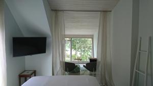 TV a/nebo společenská místnost v ubytování Guest House Vidlauči