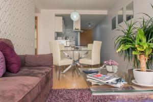 a living room with a couch and a table at Immaculate Chapultepec Apartment in Mexico City