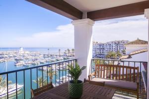 a balcony with a view of the marina at Duquesa Seaview marina in Manilva