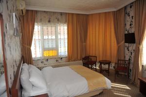 Postel nebo postele na pokoji v ubytování Saray Hotel