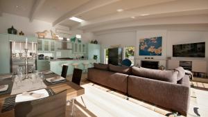a living room with a couch and a table at Cloud 9 in Russell