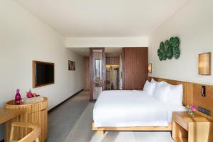 Ein Bett oder Betten in einem Zimmer der Unterkunft Dusit Princess Moonrise Beach Resort
