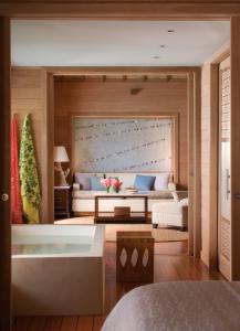 Voodi või voodid majutusasutuse Four Seasons Resort Bora Bora toas