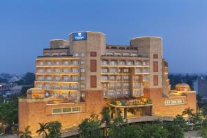 a large building with a sign on top of it at Park Plaza, Ludhiana in Ludhiana