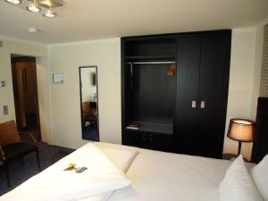 Postel nebo postele na pokoji v ubytování Top Hotel Krämer