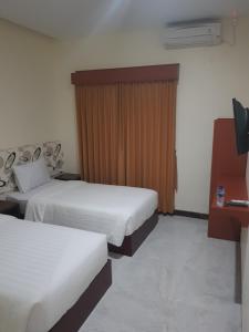 Praba Guesthouse客房内的一张或多张床位