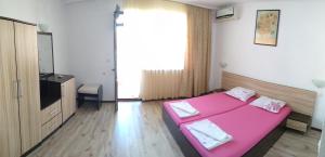 A bed or beds in a room at Villa Diana Self check-in