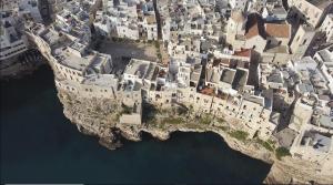 an aerial view of an island in the water at Dimora Talenti in Polignano a Mare