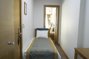 Postel nebo postele na pokoji v ubytování Cumbali Suite Hotel