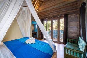 Tempat tidur dalam kamar di Song Lambung Beach Huts