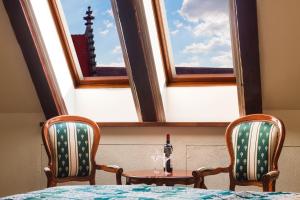 Postel nebo postele na pokoji v ubytování Arcadia Boutique Hotel