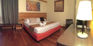 Postel nebo postele na pokoji v ubytování Best Western Hotel Dei Cavalieri