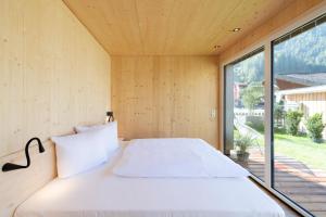 A bed or beds in a room at Ferienhaus zum Stubaier Gletscher - Dorf