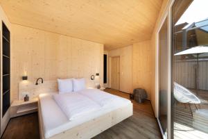 A bed or beds in a room at Ferienhaus zum Stubaier Gletscher - Dorf