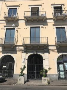 a building with balconies on the side of it at Urban Pop 2 BnB in Catania