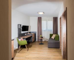 TV a/nebo společenská místnost v ubytování Landhotel Zum Adler