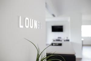 TV a/nebo společenská místnost v ubytování Einzigartiges Loft von Loftalive