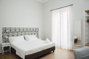 Posteľ alebo postele v izbe v ubytovaní Elysium B&B