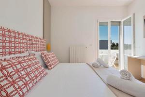 Postel nebo postele na pokoji v ubytování Absolute Suite Apartments