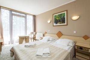 Łóżko lub łóżka w pokoju w obiekcie Geovita Zakopane