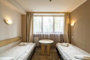 Łóżko lub łóżka w pokoju w obiekcie Geovita Zakopane