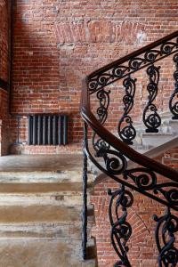 a brick wall with a bench next to a brick staircase at PR Myasnitsky Boutique Hotel in Moscow