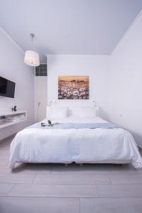 Postel nebo postele na pokoji v ubytování Aegialis Hotel & Spa