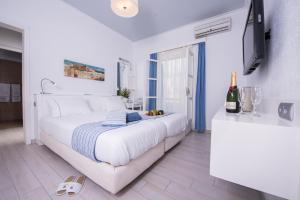 Postel nebo postele na pokoji v ubytování Aegialis Hotel & Spa