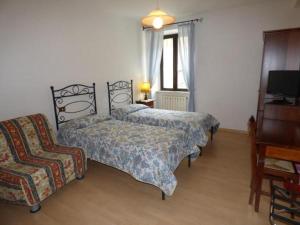 Ένα ή περισσότερα κρεβάτια σε δωμάτιο στο " Il Bersagliere " Dependance Hotel la Pace
