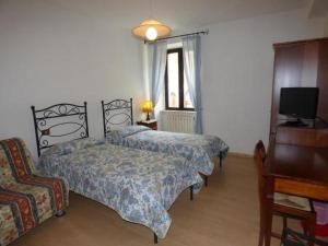 Кровать или кровати в номере " Il Bersagliere " Dependance Hotel la Pace