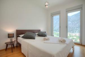 Ένα ή περισσότερα κρεβάτια σε δωμάτιο στο Aria Apartments
