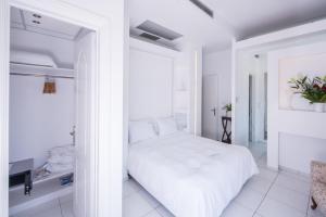Postel nebo postele na pokoji v ubytování Aegialis Hotel & Spa