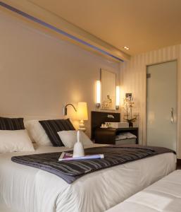 Кровать или кровати в номере Gran Hotel Nagari Boutique & Spa