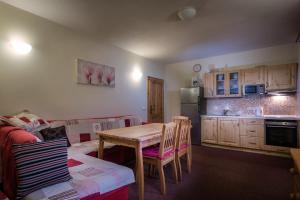 A kitchen or kitchenette at Guest House Privat Pod Lesom