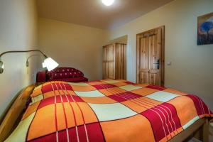 A bed or beds in a room at Guest House Privat Pod Lesom