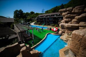 a view of a swimming pool in a resort at Ros Mari in Lazarevskoye