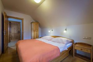 A bed or beds in a room at Guest House Privat Pod Lesom