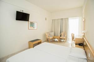Cama ou camas em um quarto em Hotel Riviera
