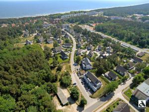 an aerial view of a town with houses and a road at Kapitaensweg 4 Koje 04 in Ostseebad Karlshagen