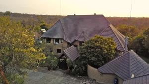 an aerial view of a house with a roof at Grand Kruger Lodge and Spa in Marloth Park