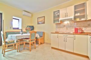 Kuchyň nebo kuchyňský kout v ubytování Lorena Apartments