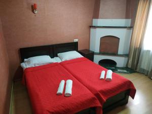 Säng eller sängar i ett rum på Hotel Lions