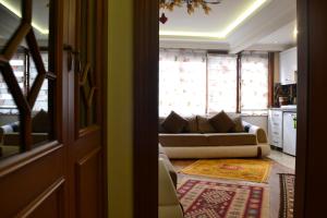 a living room with a couch and a window at Grand Fatih Hotel in Istanbul +38 photos